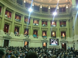 Onlookers in the Argentinean Chamber of Deputies turn their backs during speeches by opposition congressman.