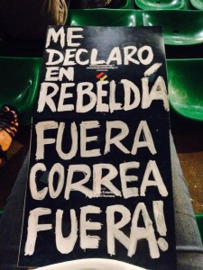 Ecuadorian immigrants brought protest signs to President Correa's Citizen Link recording in Milan, Italy. 