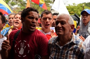 Robert Redman's father takes part in a demonstration in Caracas months after his son's murder. 