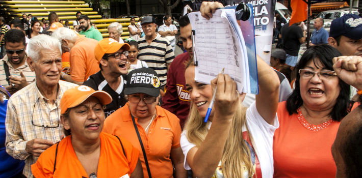 The wife of opposition leader Leopoldo López signs a petition calling for a constituent assembly on Saturday