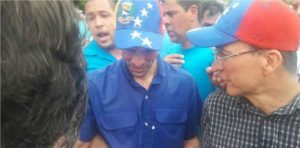 Former presidential candidate Henrique Capriles after being attacked with pepper spray, on Wednesday, during a march to demand a Venezuelan recall referendum.