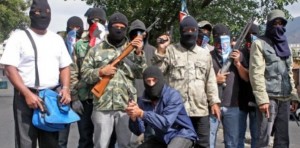 "Tupamaros" brandish their weapons on the streets of Venezuela.