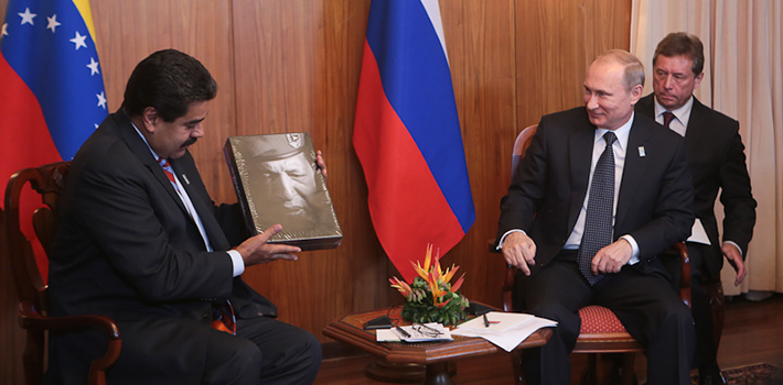 President Maduro presents Vladimir Putin with a gift to remember former President Hugo Chávez.